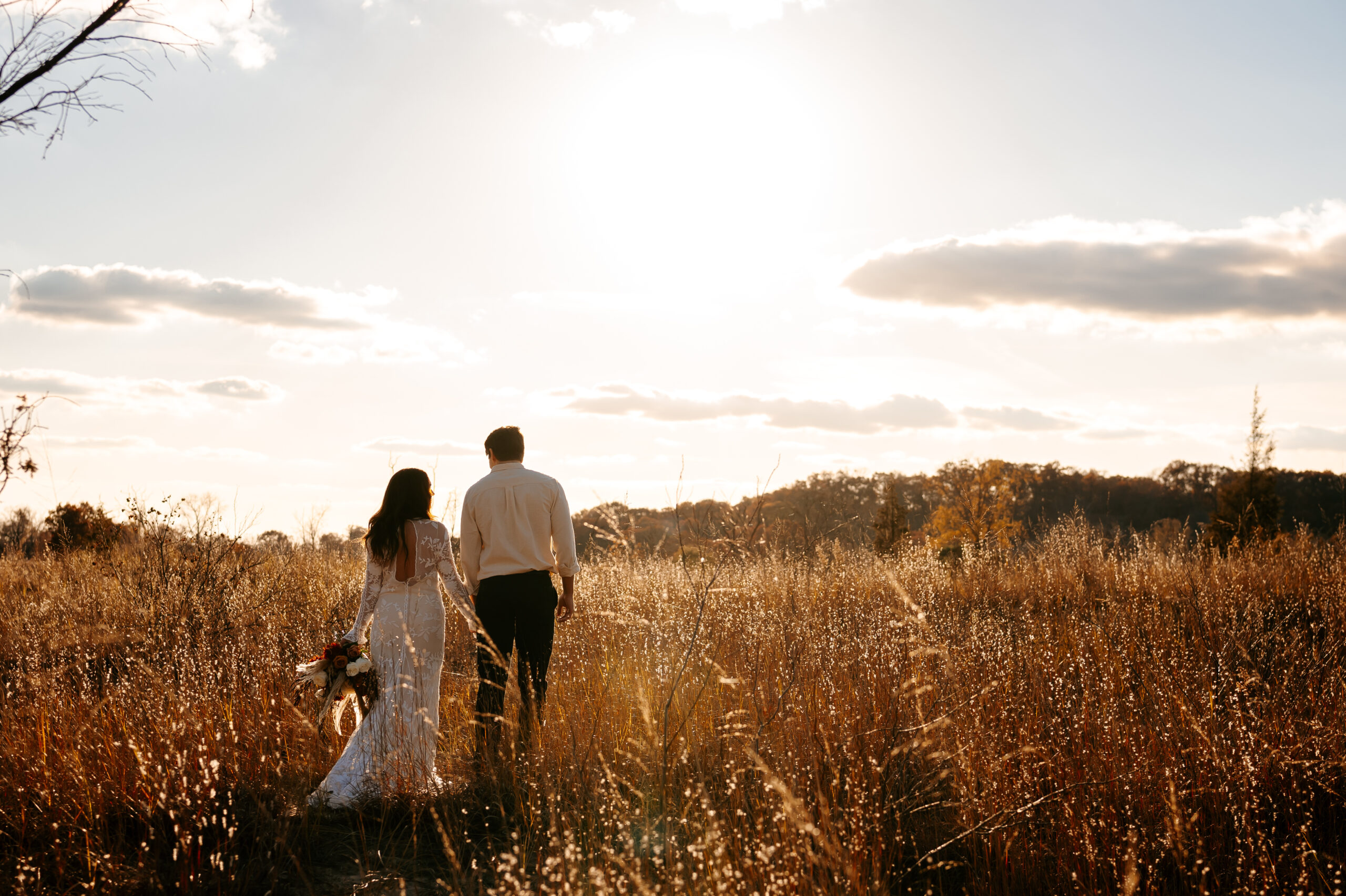 Newlyweds walking through Indiana Dunes