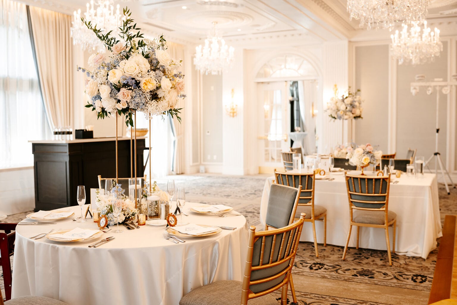 Elegant Hotel Carmichael wedding reception with chandeliers and floral centerpieces