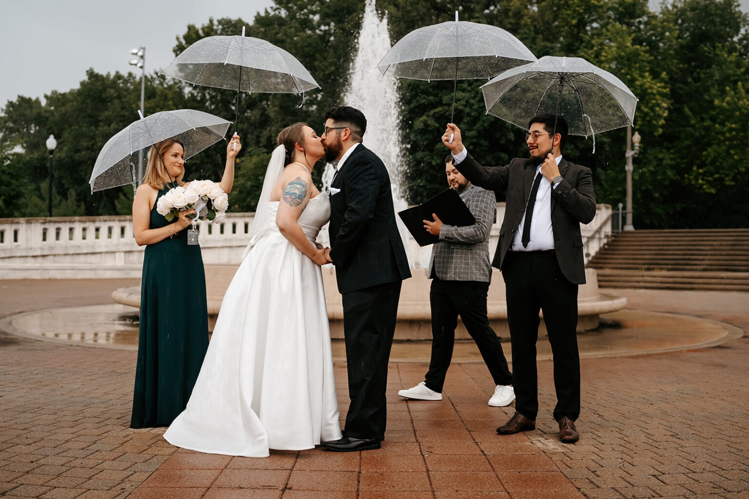 Alvaro and Brennan kiss under clear umbrellas in West Lafayette