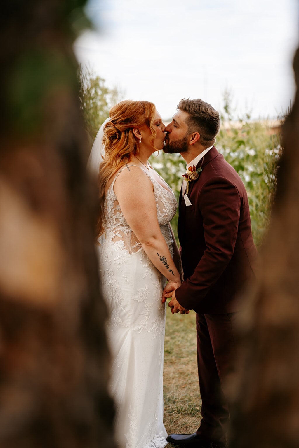 Newlyweds kissing during Backyard Wedding